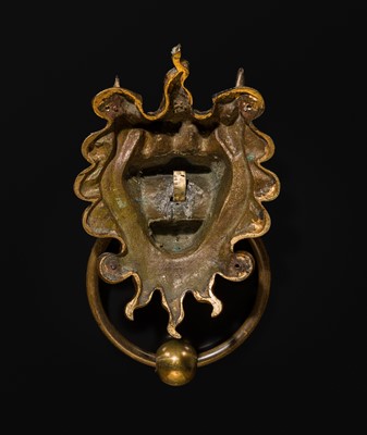 Lot 135 - A RARE GILT-BRONZE ‘BEAST-MASK’ DOOR KNOCKER, QING DYNASTY OR EARLIER