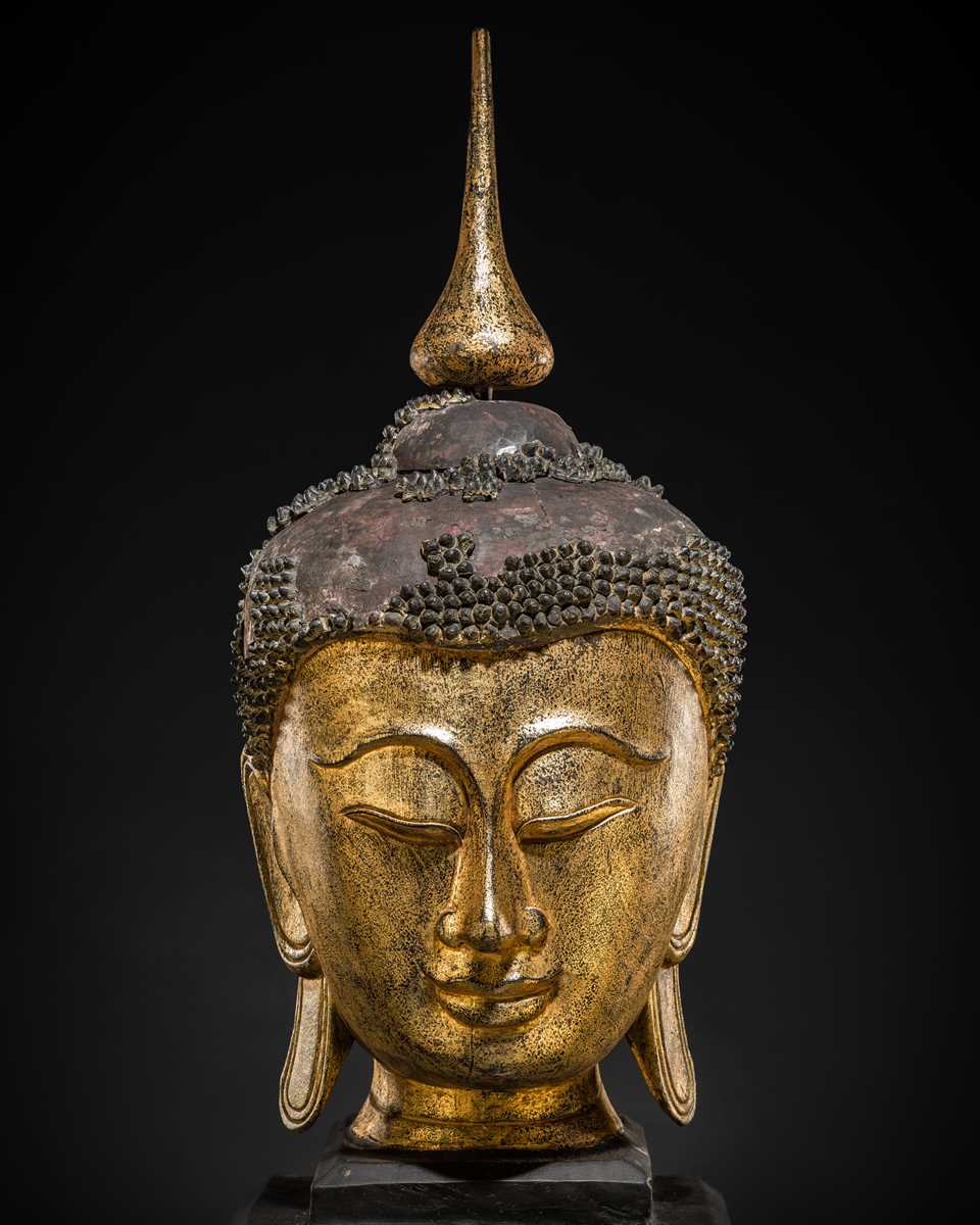 Lot 22 - A VERY LARGE GILT-LACQUERED WOOD HEAD OF BUDDHA, SHAN STYLE, 19TH CENTURY