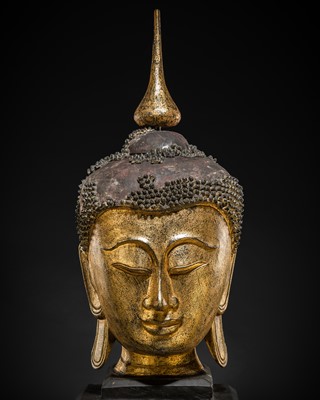 Lot 22 - A VERY LARGE GILT-LACQUERED WOOD HEAD OF BUDDHA, SHAN STYLE, 19TH CENTURY