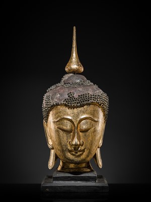 Lot 22 - A VERY LARGE GILT-LACQUERED WOOD HEAD OF BUDDHA, SHAN STYLE, 19TH CENTURY