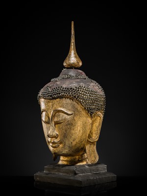 Lot 22 - A VERY LARGE GILT-LACQUERED WOOD HEAD OF BUDDHA, SHAN STYLE, 19TH CENTURY