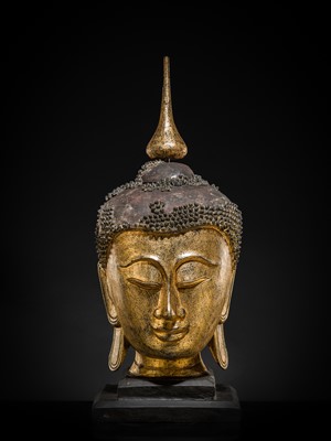 Lot 22 - A VERY LARGE GILT-LACQUERED WOOD HEAD OF BUDDHA, SHAN STYLE, 19TH CENTURY