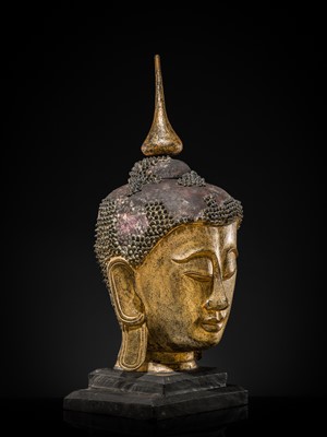 Lot 22 - A VERY LARGE GILT-LACQUERED WOOD HEAD OF BUDDHA, SHAN STYLE, 19TH CENTURY