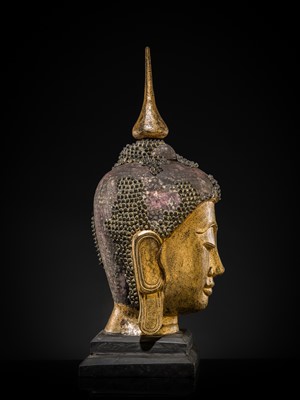 Lot 22 - A VERY LARGE GILT-LACQUERED WOOD HEAD OF BUDDHA, SHAN STYLE, 19TH CENTURY