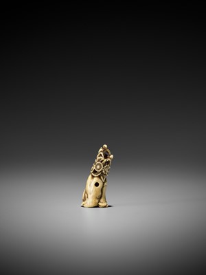 Lot 207 - A RARE AND EARLY STAG ANTLER NETSUKE OF KIKUJIDO