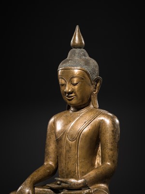 Lot 13 - A LARGE AND EXCEPTIONAL BRONZE FIGURE OF BUDDHA SHAKYAMUNI, SHAN STYLE, 17TH-18TH CENTURY
