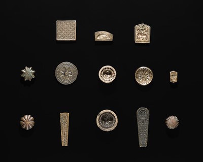 Lot 213 - A GROUP OF THIRTEEN BRONZE MOLDS AND SCALE WEIGHTS, 20TH CENTURY OR EARLIER