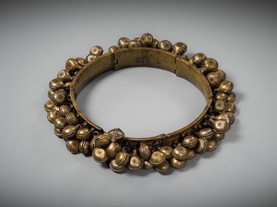 Lot 159 - A LARGE BRASS DANCER’S BELT WITH BELLS, ARAMANI, KERALA, 18TH-19TH CENTURY