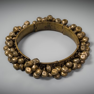 Lot 159 - A LARGE BRASS DANCER’S BELT WITH BELLS, ARAMANI, KERALA, 18TH-19TH CENTURY