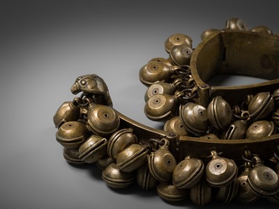 Lot 159 - A LARGE BRASS DANCER’S BELT WITH BELLS, ARAMANI, KERALA, 18TH-19TH CENTURY