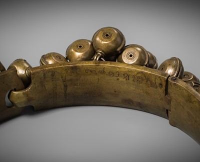 Lot 159 - A LARGE BRASS DANCER’S BELT WITH BELLS, ARAMANI, KERALA, 18TH-19TH CENTURY