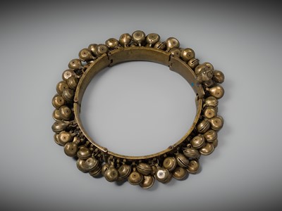 Lot 159 - A LARGE BRASS DANCER’S BELT WITH BELLS, ARAMANI, KERALA, 18TH-19TH CENTURY