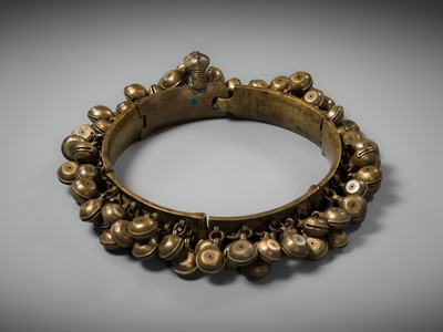 Lot 159 - A LARGE BRASS DANCER’S BELT WITH BELLS, ARAMANI, KERALA, 18TH-19TH CENTURY