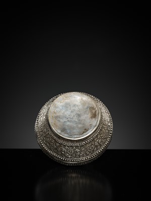 Lot 153 - A SILVER REPOUSSÉ BETEL-NUT BOX AND COVER, 19TH-EARLY 20TH CENTURY