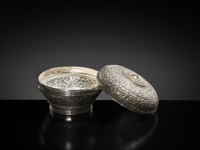 Lot 153 - A SILVER REPOUSSÉ BETEL-NUT BOX AND COVER, 19TH-EARLY 20TH CENTURY
