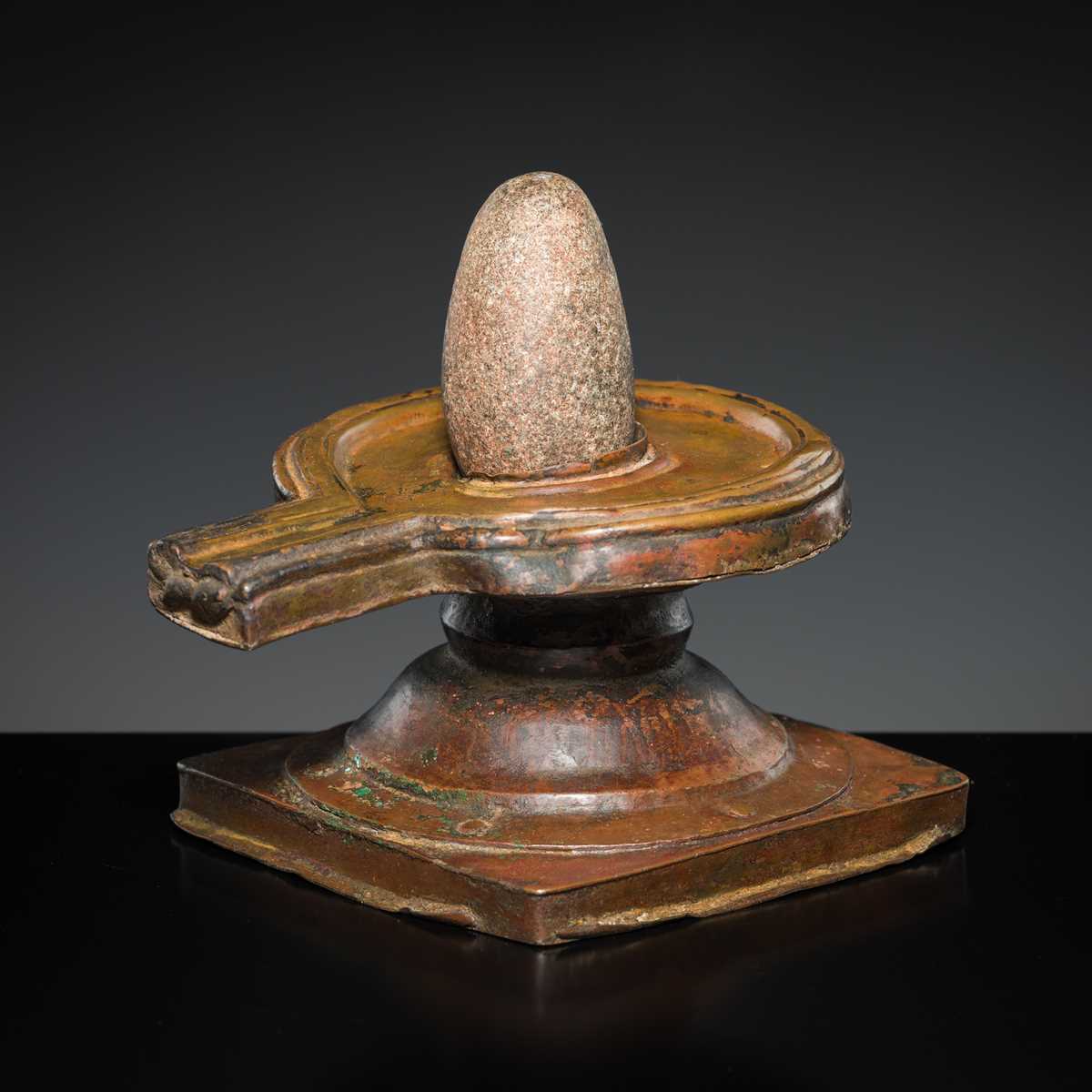 Lot 188 - A STONE LINGAM AND COPPER YONI, INDIA, 19TH CENTURY OR EARLIER