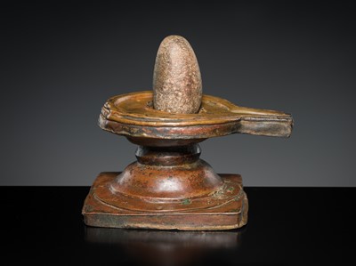 Lot 188 - A STONE LINGAM AND COPPER YONI, INDIA, 19TH CENTURY OR EARLIER