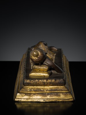Lot 147 - A PARCE-GILT BRONZE FIGURE OF BUDDHA IN PARINIRVANA, RATTANAKOSIN KINGDOM