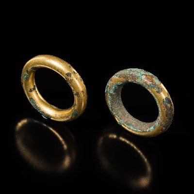 Lot 239 - A PAIR OF GILT-BRONZE RING HANDLES, WARRING STATES PERIOD