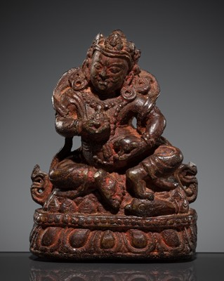 Lot 196 - A STONE FIGURE OF JAMBHALA, NEPAL, 16TH -17TH CENTURY OR EARLIER