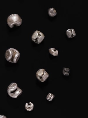 Lot 154 - A LOT OF SILVER AND IRON COINS, BEADS, AND INGOTS, 19TH-20TH CENTURY