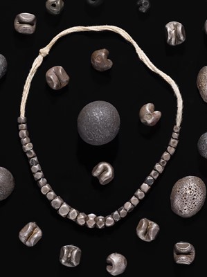 Lot 154 - A LOT OF SILVER AND IRON COINS, BEADS, AND INGOTS, 19TH-20TH CENTURY