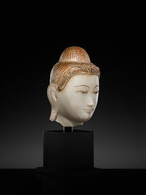 Lot 20 - A GILT-LACQUERED AND GLASS INLAID WHITE ALABASTER HEAD OF BUDDHA, MANDALAY, 18TH-19TH CENTURY