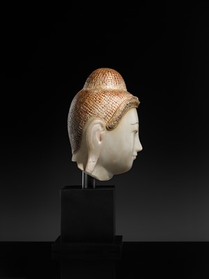 Lot 20 - A GILT-LACQUERED AND GLASS INLAID WHITE ALABASTER HEAD OF BUDDHA, MANDALAY, 18TH-19TH CENTURY