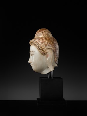 Lot 20 - A GILT-LACQUERED AND GLASS INLAID WHITE ALABASTER HEAD OF BUDDHA, MANDALAY, 18TH-19TH CENTURY