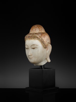 Lot 20 - A GILT-LACQUERED AND GLASS INLAID WHITE ALABASTER HEAD OF BUDDHA, MANDALAY, 18TH-19TH CENTURY