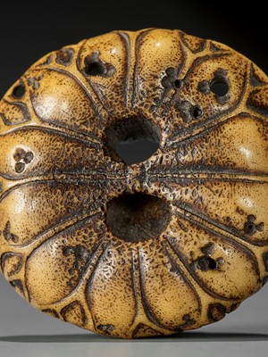 Lot 213 - A FINE STAG ANTLER MANJU NETSUKE WITH MOKUGYO AND LOTUS