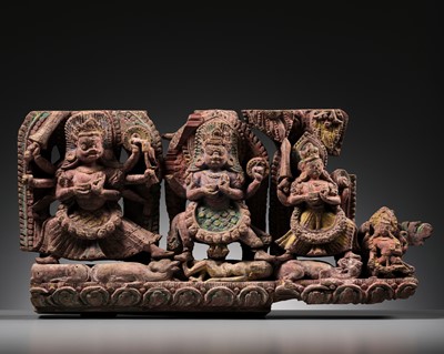 Lot 118 - A CARVED WOOD PANEL WITH UGRACHANDI, CHAMUNDA AND KUMARI, 16TH-18TH CENTURY