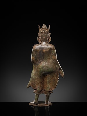 Lot 66 - A LARGE SILVER-INLAID BRONZE FIGURE OF THE CROWNED BUDDHA, KASHMIR, 9TH-10TH CENTURY