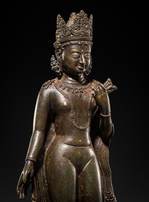 Lot 66 - A LARGE SILVER-INLAID BRONZE FIGURE OF THE CROWNED BUDDHA, KASHMIR, 9TH-10TH CENTURY