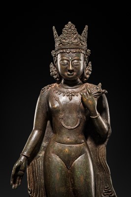 Lot 66 - A LARGE SILVER-INLAID BRONZE FIGURE OF THE CROWNED BUDDHA, KASHMIR, 9TH-10TH CENTURY