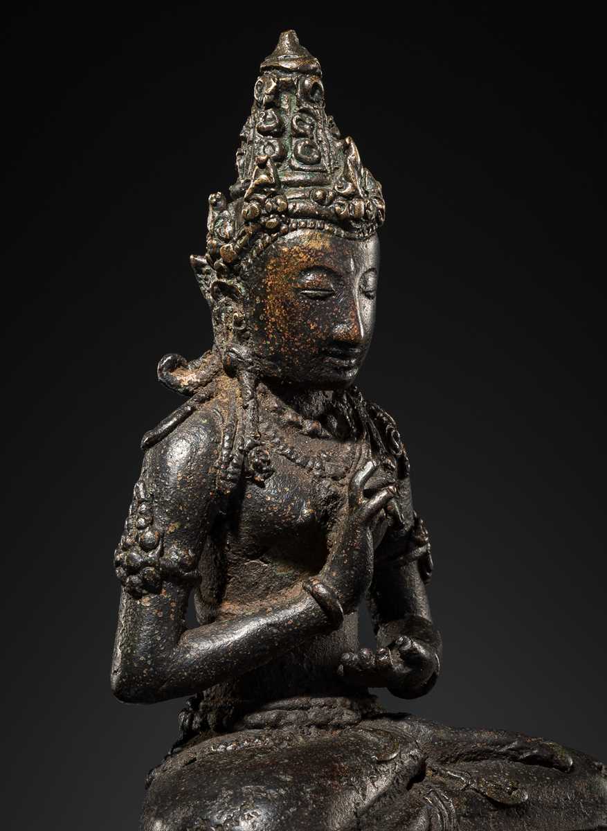 Lot 50 - A BRONZE FIGURE OF VAIROCANA, CENTRAL JAVA, 9TH-11TH CENTURY