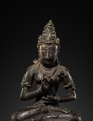 Lot 50 - A BRONZE FIGURE OF VAIROCANA, CENTRAL JAVA, 9TH-11TH CENTURY