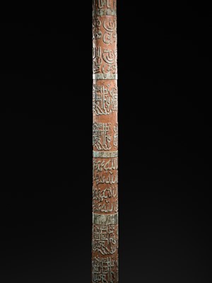 Lot 98 - A LARGE CALLIGRAPHIC WOOD COLUMN, INSCRIBED IN KUFIC, NASKH, AND THULUTH, WITH A MASSIVE STONE BASE