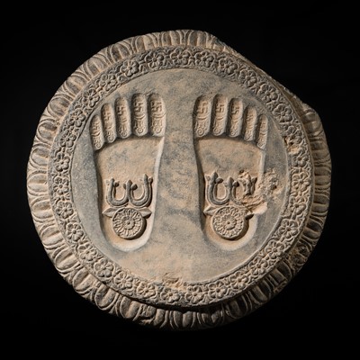 Lot 60 - A SCHIST RELIEF OF THE FOOTPRINTS OF BUDDHA, BUDDHAPADA, 4TH-5TH CENTURY OR EARLIER