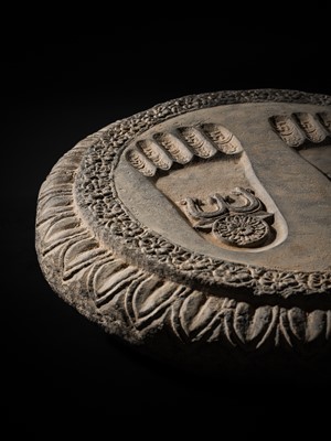 Lot 60 - A SCHIST RELIEF OF THE FOOTPRINTS OF BUDDHA, BUDDHAPADA, 4TH-5TH CENTURY OR EARLIER