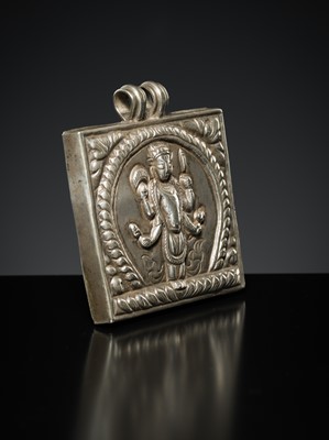 Lot 201 - A GROUP OF TWO SILVER REPOUSSÉ AMULET PENDANTS AND A PILGRIMAGE PLAQUE, 19TH-EARLY 20TH CENTURY