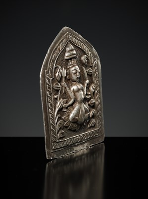 Lot 201 - A GROUP OF TWO SILVER REPOUSSÉ AMULET PENDANTS AND A PILGRIMAGE PLAQUE, 19TH-EARLY 20TH CENTURY