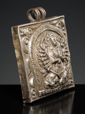 Lot 201 - A GROUP OF TWO SILVER REPOUSSÉ AMULET PENDANTS AND A PILGRIMAGE PLAQUE, 19TH-EARLY 20TH CENTURY