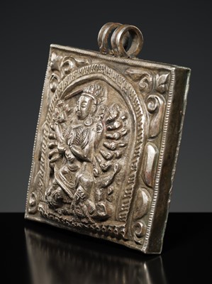 Lot 201 - A GROUP OF TWO SILVER REPOUSSÉ AMULET PENDANTS AND A PILGRIMAGE PLAQUE, 19TH-EARLY 20TH CENTURY