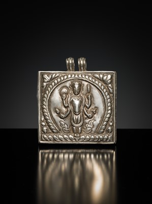 Lot 201 - A GROUP OF TWO SILVER REPOUSSÉ AMULET PENDANTS AND A PILGRIMAGE PLAQUE, 19TH-EARLY 20TH CENTURY