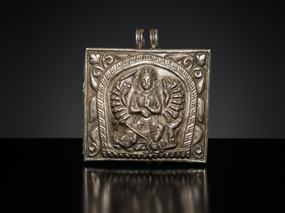 Lot 201 - A GROUP OF TWO SILVER REPOUSSÉ AMULET PENDANTS AND A PILGRIMAGE PLAQUE, 19TH-EARLY 20TH CENTURY