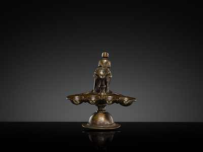 Lot 180 - A BRONZE ‘ELEPHANT AND MAHOUT’ ARATI LAMP, MAHARASHTRA