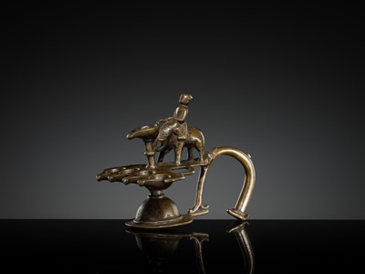 Lot 180 - A BRONZE ‘ELEPHANT AND MAHOUT’ ARATI LAMP, MAHARASHTRA