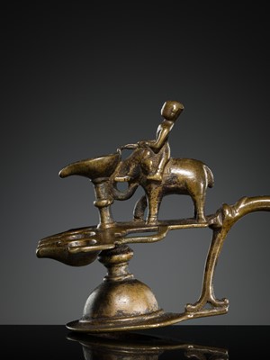 Lot 180 - A BRONZE ‘ELEPHANT AND MAHOUT’ ARATI LAMP, MAHARASHTRA