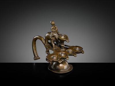 Lot 180 - A BRONZE ‘ELEPHANT AND MAHOUT’ ARATI LAMP, MAHARASHTRA
